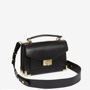 THE KOOPLES SMALL BLACK LEATHER HANDBAG WITH GOLD DETAILS